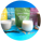 Colorful packages of Magic Oats oat milk powder displayed on a bright blue background, accompanied by glasses of oat milk, vanilla beans, and scattered oats.