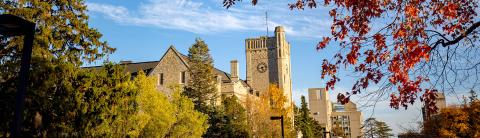 Johnston Hall at the University of Guelph on a bright autumn day with vibrant fall foliage, captured for the OAC AA and OAC Alumni Foundation AGM event.